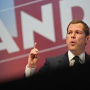 Robert Jenrick delivers a speech during the Conservative Party Conference in Birmingham