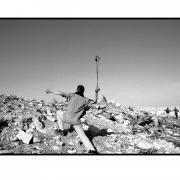 Palestinian uses slingshot against Israeli troops -West Bank. Intifada - war of the stones All Pics Â© David Pratt.