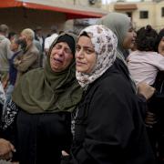 Palestinians mourn for a relative killed in the Israeli bombardment of the Gaza Strip