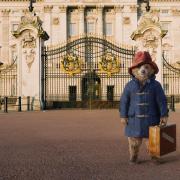 A still from Paddington 2 shows the bear outside Buckingham Palace