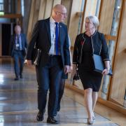 First Minister John Swinney and Finance Secretary Shona Robison pictured in the Scottish Parliament