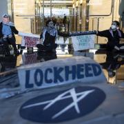 Police remove pro-Palestine activists after they shut down Lockheed Martin's headquarters entrance to demand an end to their weapons supply to Israel