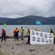 Anti-nuclear demonstrators on a beach near Coulport