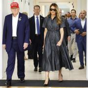 Donald Trump and Melania Trump walk after voting on US election day