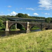 The bridge carries people across the Tweed