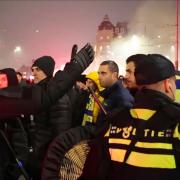 Police escort Maccabi Tel Aviv supporters to the metro station leading them to the Ajax stadium