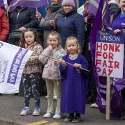 Striking school support workers take part in a demonstration outside First Minister John Swinney's constituency office in Blairgowrie