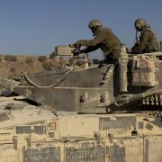 An Israeli soldier patrols near the border with the Gaza Strip