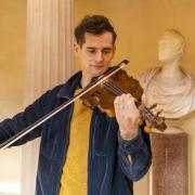 Ewen Henderson inside the Burns Monument playing the Gregg fiddle