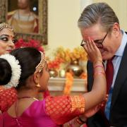 Prime Minister Sir Keir Starmer has a tilak applied by a member of the Arunima Kumar Dance Company during a reception to mark Diwali, at 10 Downing Street (Mina Kim/PA)