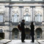 Edinburgh University students at Old College sunday wait for the library to open..