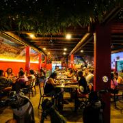 Foreign tourists have a drink at a night club at Nana Backpack hostel in Vang Vieng, Laos (Anupam Nath/AP)