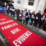 Bereaved families demonstrate outside Dorland House (James Manning/PA)