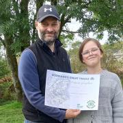 Ian and Eve with their NatureScot certificate for completing all 29 of Scotland’s Great Trails