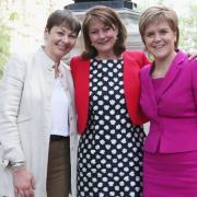 Leanne Wood (centre) has invited Nicola Sturgeon to Wales once she officially steps down