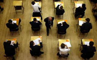 Students taking an exam. Credit: PA