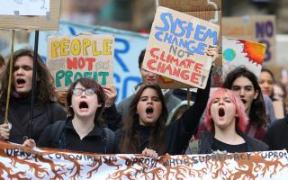 Climate activists taking part in a Fridays for Future climate strike march through Glasgow, Friday 28 October 2022