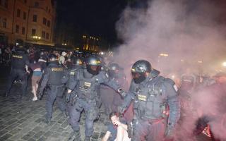 A scuffle broke out after police officers tried to confiscate a lit flare as fans gathered in the Old Town area of the city.