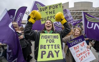 Members of Unison rally outside the Scottish Parliament as they demand better pay
