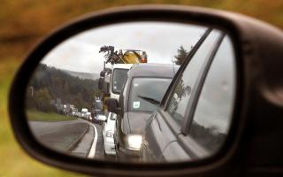 A traffic jam pictured in the wing mirror of a car on the A9