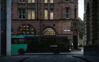An Ember bus makes its way into Edinburgh city centre