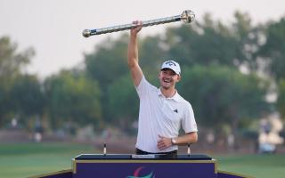 Nicolai Hojgaard of Denmark poses with his trophy after winning the DP World Tour Championship in Dubai (Kamran Jebreili/AP)