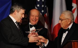 Prime Minister Gordon Brown (left) is awarded the Appeal of Conscience Foundation's World Statesman of the Year Award Henry Kissinger (right) in New York