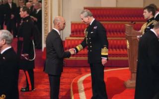 Former Scottish Police Federation general secretary Joe Grant is given an MBE by the then-prince Charles in 2009