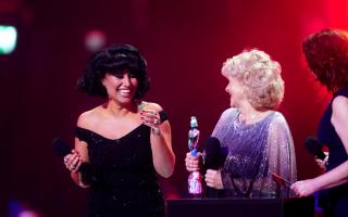 Raye on stage with Jo Hamilton after winning the award for Song of the Year