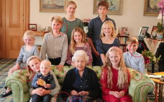 An image posted by Kensington Palace of the late Queen and her grandchildren has been edited