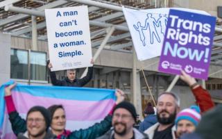 Trans rights and gender critical campaigners protest outside the Scottish parliament