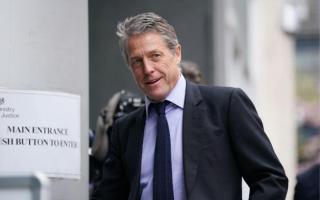 Hugh Grant has settled his High Court claim, a judge was told