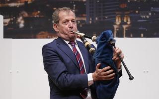 Alastair Campbell plays the bagpipes to mark 25 years of the Good Friday Agreement in Belfast in 2023