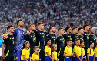 The Scotland team lines-up for Flower of Scotland