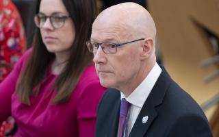 John Swinney pictured in the Holyrood chamber during FMQs