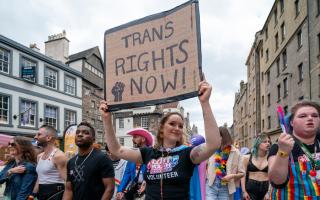 A LGBT Youth Scotland volunteer takes part in Edinburgh Pride