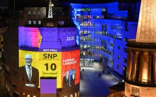 The results of the General Election exit poll projected onto the BBC building in London