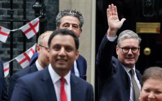 Keir Starmer waves outside an England-decorated Downing Street as Scottish Labour MPs visit