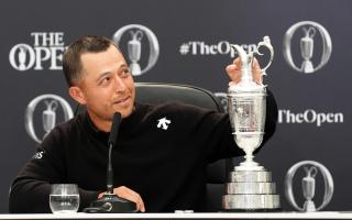Xander Schauffele gave his dad Stefan the honour of the first drink from the Claret Jug (Zac Goodwin/PA)
