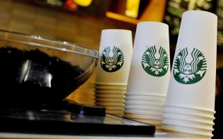 File photograph of cups stacked beside a coffee machine