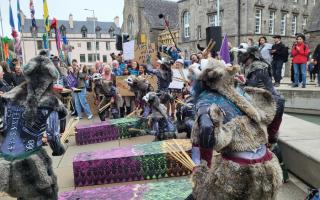 Hundreds of people gathered outside Holyrood on Thursday afternoon to protest against cuts to Scotland's culture budget