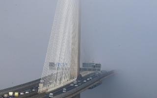 A contrast in weather created by the better temperatures formed a wall of fog in the middle of the bridge