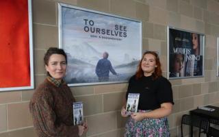 Director Jane McAllister, left, in front of the To See Ourselves poster