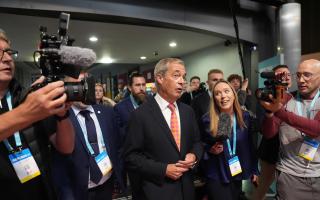 Leader of Reform UK Nigel Farage arrives at the party's annual conference