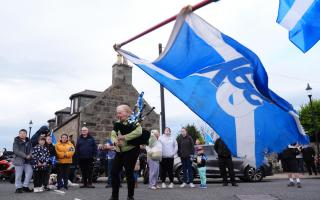 A piper plays outside after the coffin of former first minister of Scotland Alex Salmond was taken into Fraserburgh Funeral Services