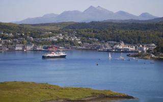 A ferry sails into Oban Bay