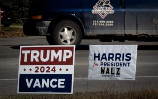 TRAVERSE CITY, MICHIGAN - SEPTEMBER 26: Signs showing support for both Democratic presidential candidate Vice President Kamala Harris and Republican presidential candidate former President Donald Trump sit along a rural highway on September 26, 2024 near