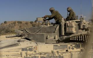 An Israeli soldier patrols near the border with the Gaza Strip