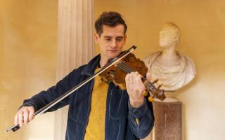 Ewen Henderson inside the Burns Monument playing the Gregg fiddle