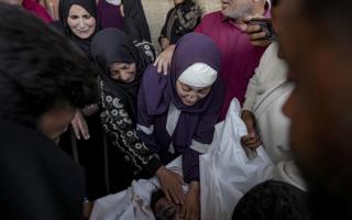 Palestinians mourn their relatives killed in an Israeli bombardment of the Gaza Strip